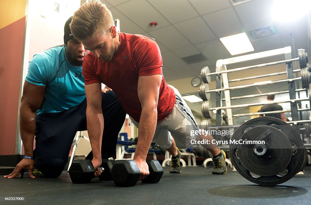 Nick Miller works out with personal trainer Nick Natt as he trains for a firefighting position.