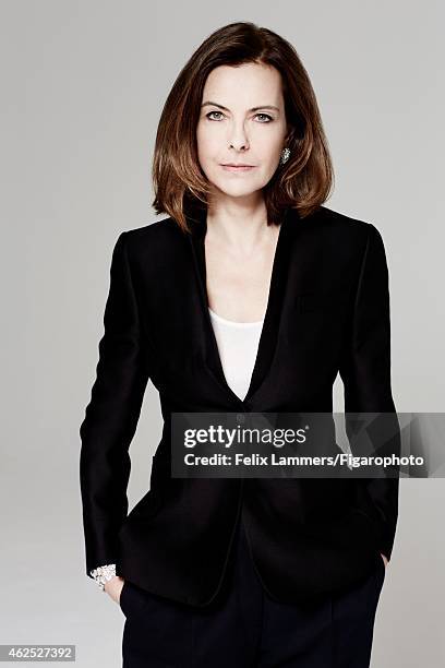 Actress Carole Bouquet is photographed for Madame Figaro on December 22, 2014 in Paris, France. Jacket , tank top , pants , earrings and cuff ....