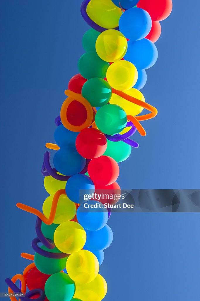 Balloons against blue sky