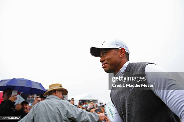 Tiger Woods exits the course after finishing 11 over-par for a total of 13 over-par after his second round of the Waste Management Phoenix Open at...