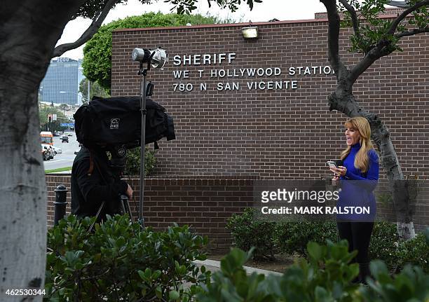 Member of the media is seen in front of the West Hollywood Sheriff's Department station where rapper Marion "Suge" Knight surrendered to deputies in...