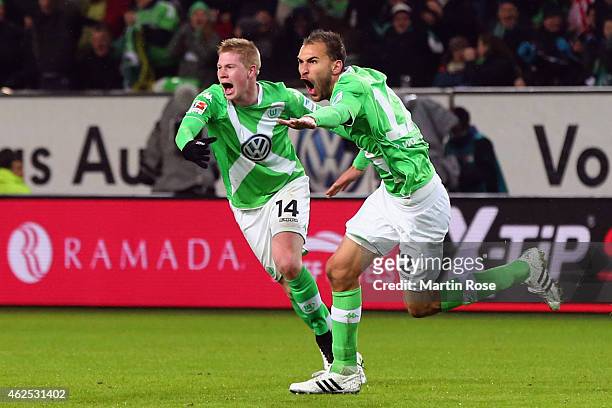 Bas Dost of Wolfsburg celebrates his team's second goal with team mate Kevin de Bruyne during the Bundesliga match between VfL Wolfsburg and FC...