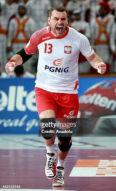 Poland's Bartosz Jurecki celebrates after a position during the 24th Men's Handball World Championships semifinal handball match between Poland and...