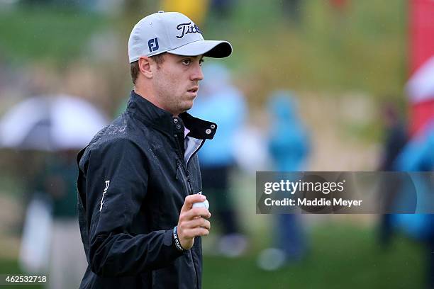 Justin Thomas acknowledges the crowd on the 9th green during the second round of the Waste Management Phoenix Open at TPC Scottsdale on January 30,...