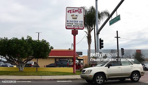 Driver passes Tam's Burger in Compton, California, on January 30, 2015 where a day earlier former rap music mogul Marion "Suge" Knight is reported to...