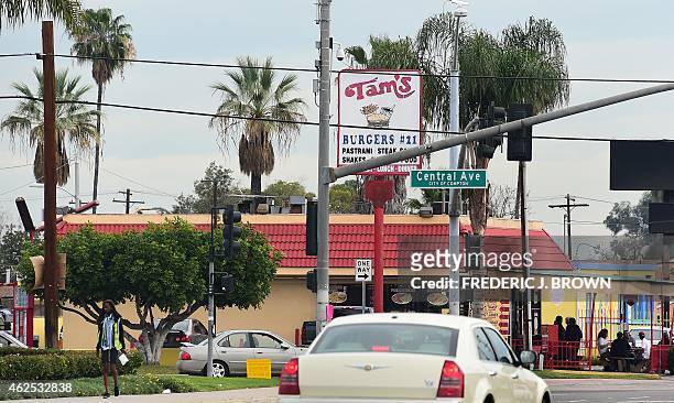 Vehicles pass Tam's Burger in Compton, California on January 30, 2015 where a day earlier former rap music mogul Marion "Suge" Knight is reported to...