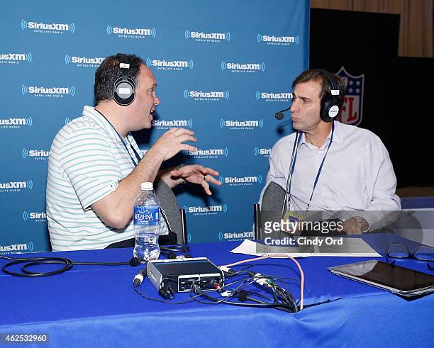 Miami Dolphins Executive Vice President of Football Ops Mike Tannenbaum and radio host Chris 'Mad Dog' Russo attend SiriusXM at Super Bowl XLIX Radio...
