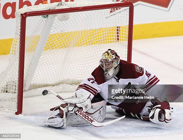 Mike Smith of the Phoenix Coyotes looks back as the puck scores on a shot by Eric O'Dell of the Winnipeg Jets in first-period action in an NHL game...
