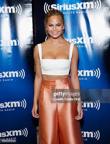 Model Chrissy Teigen attends SiriusXM at Super Bowl XLIX Radio Row at the Phoenix Convention Center on January 30, 2015 in Phoenix, Arizona.