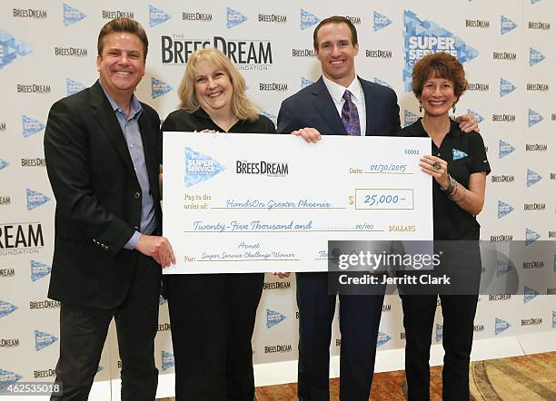 Quarterback Drew Brees and Dave Lindsey pose with Avnet Team at the Super Service Challenge Press Conference where Drew Brees Announces $1 000...