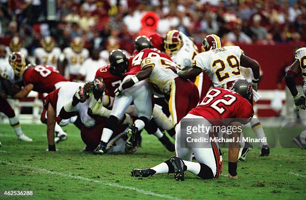 Tight End Patrick Hope of the Tampa Bay Buccaneers ends up on his knees after trying to block a run for teammate Full Back Mike Alstott during an NFL...