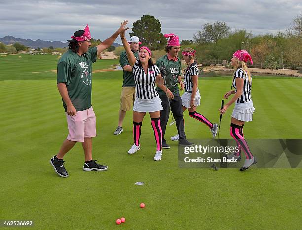 Pat Perez, Tiffany Stroud, Jason Kokrak, Martin Flores and Candice Flores celebrate their putt on the ninth hole at the Champions GC as part of a...