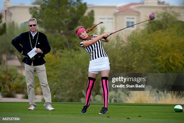 Ashley Perez hits a drive on the first tee during the PGA TOUR Wives Association charity golf outing during the Waste Management Phoenix Open, at TPC...