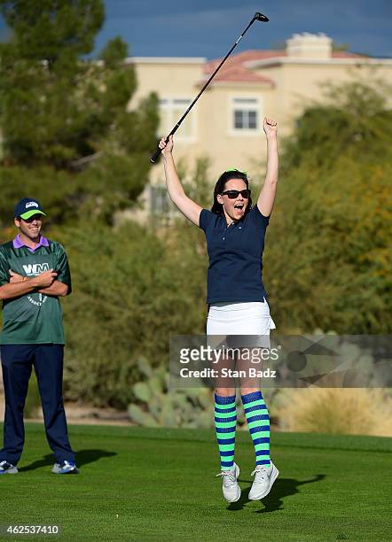 Amanda Hadley celebrates his tee shot on the first tee during the PGA TOUR Wives Association charity golf outing during the Waste Management Phoenix...