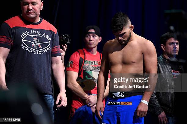 Kelvin Gastelum hangs his head after missing weight by ten pounds during the UFC 183 weigh-in at the MGM Grand Garden Arena on January 30, 2015 in...