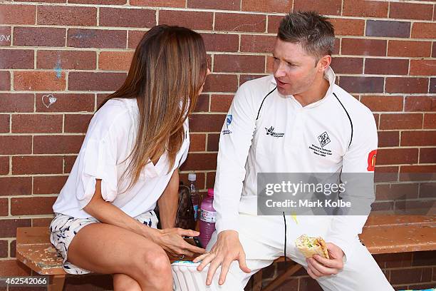 Kyly Clarke speaks with her husband Michael Clarke of Wests outside the dressing rooms during the lunch break as he bats in the Sydney Grade game...