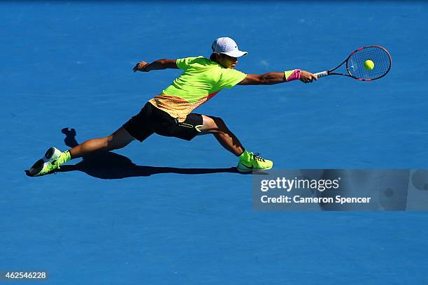 Seong-chan Hong of Korea plays a backhand in his Junior Boys' Singles Final match against Roman Safiullin of Russia during the Australian Open 2015...