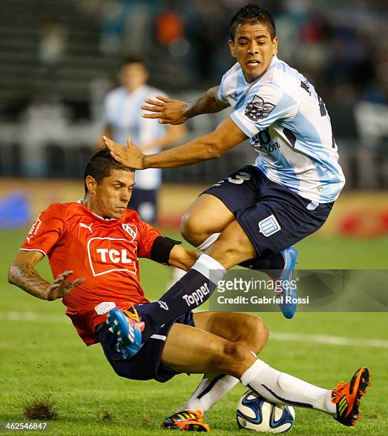 Cristian Tula of Independiente fights for the ball with Luis Ibañez of Racing Club during a match between Racing Club and Independiente as part of...
