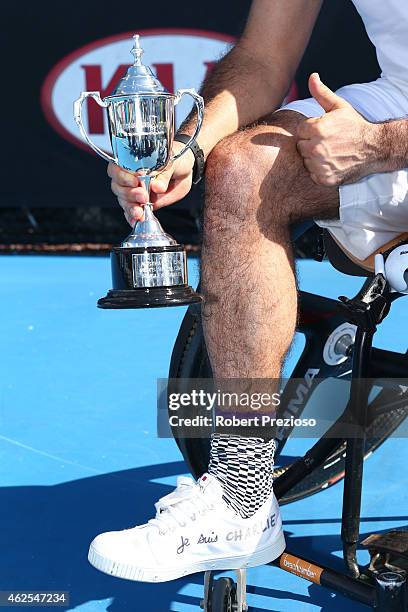 Stephane Houdet of France poses with the runner up trophy after the Men's Wheelchair Singles Final against Shingo Kunieda of Japan during the...