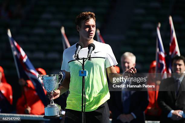 Roman Safiullin of Russia holds the winners trophy after winning the Junior Boys' Singles Final match against Seong-chan Hong of Korea during the...