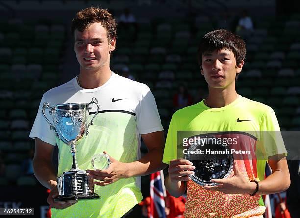 Roman Safiullin of Russia holds the winners trophy, and Seong-chan Hong of Korea with the runner up trophy after their Junior Boys' Singles Final...