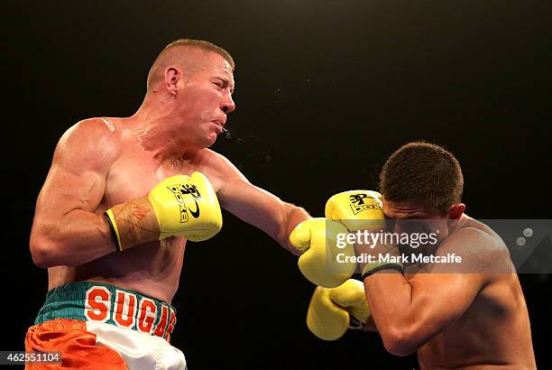 Joe Rea throws a left at Bilal Akkawy during their bout at the Footy Show Fight Night at Allphones Arena on January 31, 2015 in Sydney, Australia.