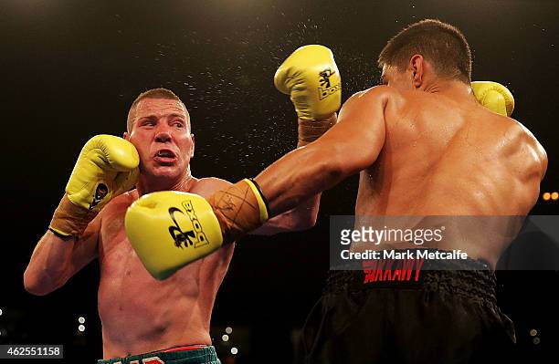 Joe Rea throws a left at Bilal Akkawy during their bout at the Footy Show Fight Night at Allphones Arena on January 31, 2015 in Sydney, Australia.