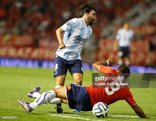 Diego Villar of Racing Club laments after receiving a foul from Claudio Morel Rodriguez of Independiente during a match between Racing Club and...
