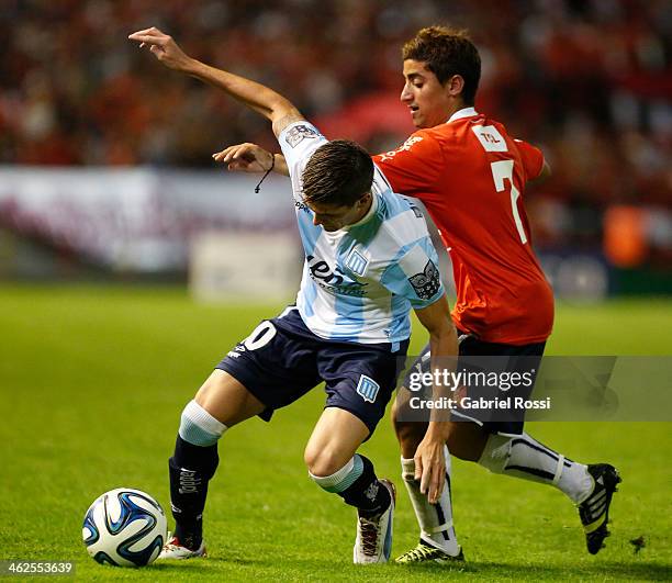 Rodrigo De Paul of Racing Club fights for the ball with Matias Pisano of Independiente during a match between Racing Club and Independiente as part...