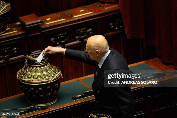 Former Italian President Giorgio Napolitano casts his ballot on January 31 at the Italian Parliament in Rome during the fourth round of vote for the...