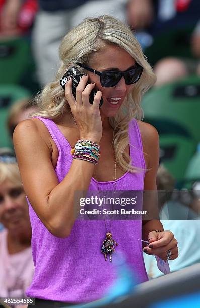 Bec Hewitt, wife of Lleyton Hewitt of Australia watches him in his first round match against Andreas Seppi of Italy during day two of the 2014...