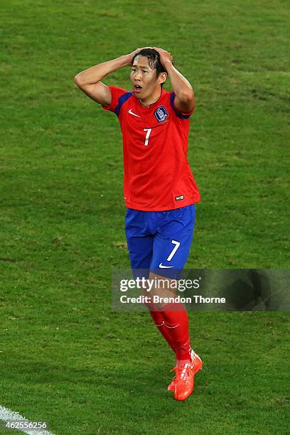 Son Heung Min of Korea Republic reacts after a missed chance at goal during the 2015 Asian Cup final match between Korea Republic and the Australian...