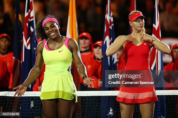 Serena Williams of the United States and Maria Sharapova of Russia stand at the presentation after Williams won their women's final match during day...