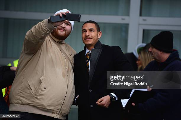 Jake Livermore of Hull City poses for a selfie with a fan prior to the Barclays Premier League match between Hull City and Newcastle United at KC...