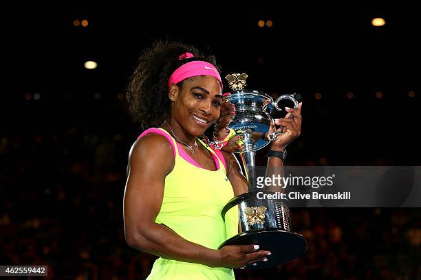 Serena Williams of the United States holds the Daphne Akhurst Memorial Cup after winning the women's final match against Maria Sharapova of Russia...