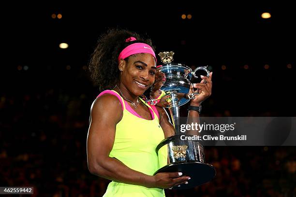 Serena Williams of the United States holds the Daphne Akhurst Memorial Cup after winning the women's final match against Maria Sharapova of Russia...