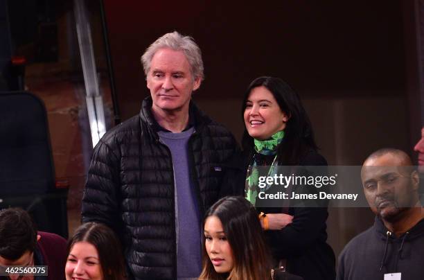 Kevin Kline and Phoebe Cates attend the Phoenix Suns vs New York Knicks game at Madison Square Garden on January 13, 2014 in New York City.