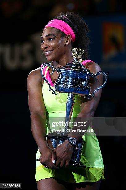 Serena Williams of the United States holds the Daphne Akhurst Memorial Cup after winning the women's final match against Maria Sharapova of Russia...