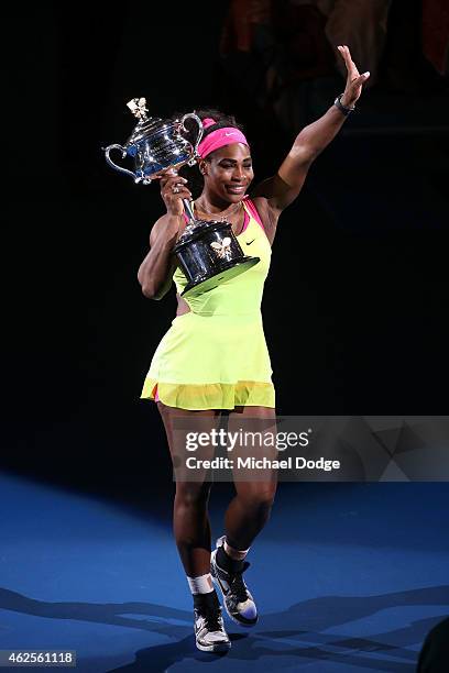 Serena Williams of the United States holds the Daphne Akhurst Memorial Cup after winning the women's final match against Maria Sharapova of Russia...