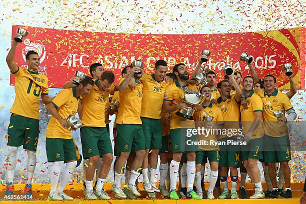 Australia celebrate with the trophy during the 2015 Asian Cup final match between Korea Republic and the Australian Socceroos at ANZ Stadium on...