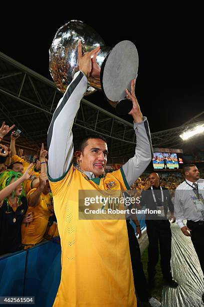 Tim Cahill of Australia celebrates with the winners trophy after Australia defeated Korea republic at the 2015 Asian Cup final match between Korea...