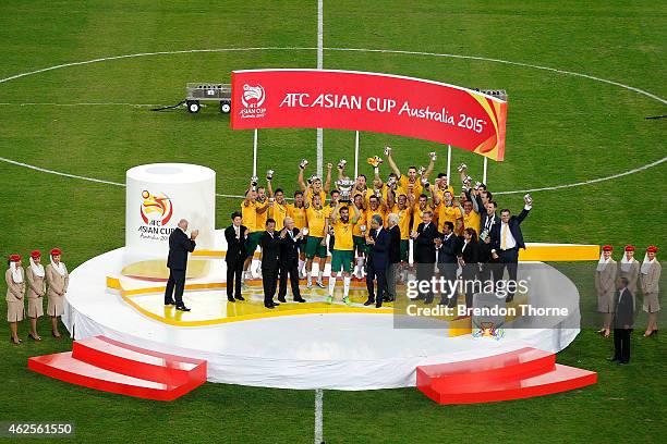 Australia celebrate with the trophy following the 2015 Asian Cup final match between Korea Republic and the Australian Socceroos at ANZ Stadium on...