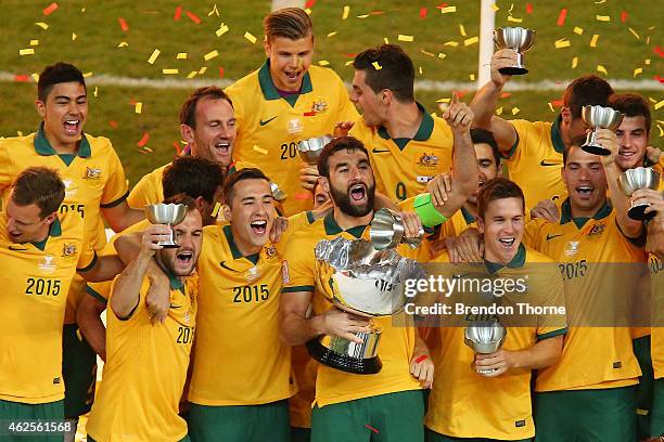 Australia celebrate with the trophy following the 2015 Asian Cup final match between Korea Republic and the Australian Socceroos at ANZ Stadium on...