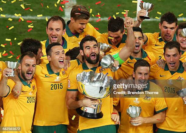 Australia celebrate with the trophy following the 2015 Asian Cup final match between Korea Republic and the Australian Socceroos at ANZ Stadium on...