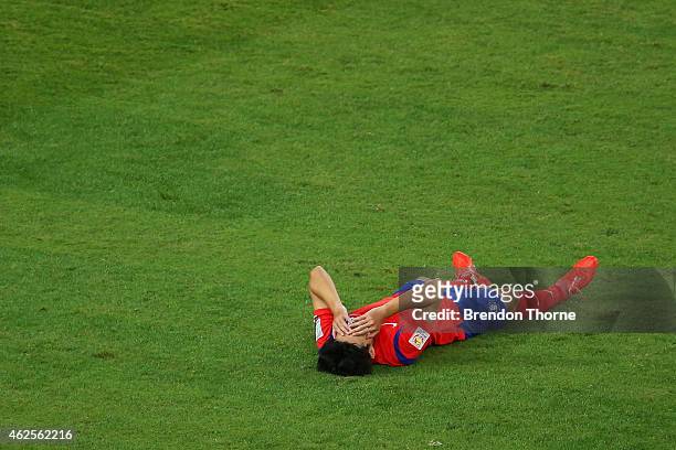 Son Heung Min of Korea Republic shows his dejection at full time following the 2015 Asian Cup final match between Korea Republic and the Australian...