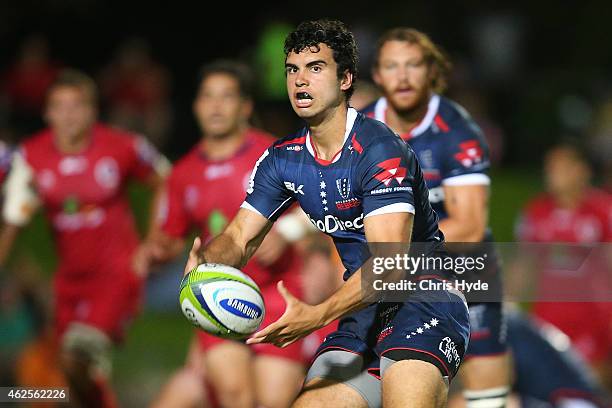 Jack Debreczeni of the Rebels passes the ball during the Super Rugby trial match between the Queensland Reds and the Melbourne Rebels at Barlow Park...