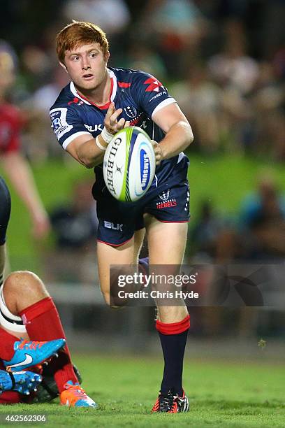 Nick Strizaker of the Rebels passes the ball during the Super Rugby trial match between the Queensland Reds and the Melbourne Rebels at Barlow Park...