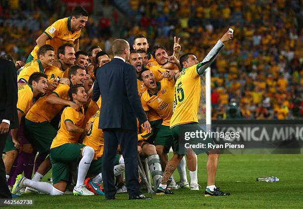 Tim Cahill of Australia takes a selfie of the team after the 2015 Asian Cup final match between Korea Republic and the Australian Socceroos at ANZ...