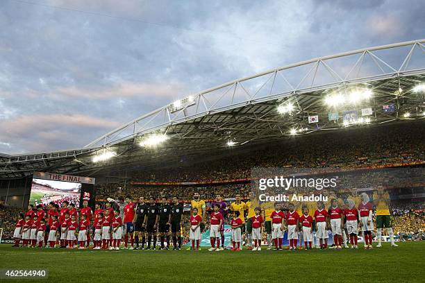 The Korean and Australian side line up before the National Anthems during the 2015 Asia Cup Final between Australia Vs South Korea in the 2015 AFC...