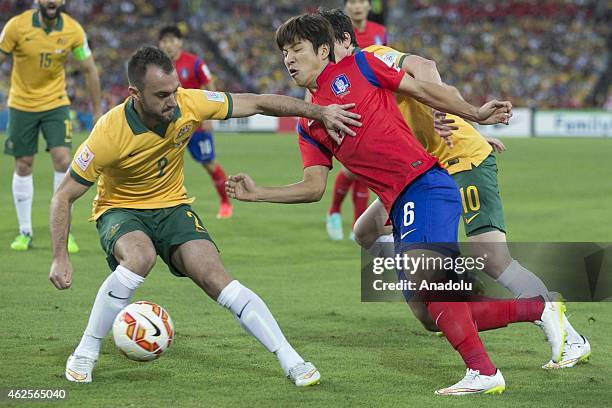 Park Joo Ho in action against Ivan Franjic during the 2015 Asia Cup Final between Australia Vs South Korea in the 2015 AFC Asian Cup match, at the...